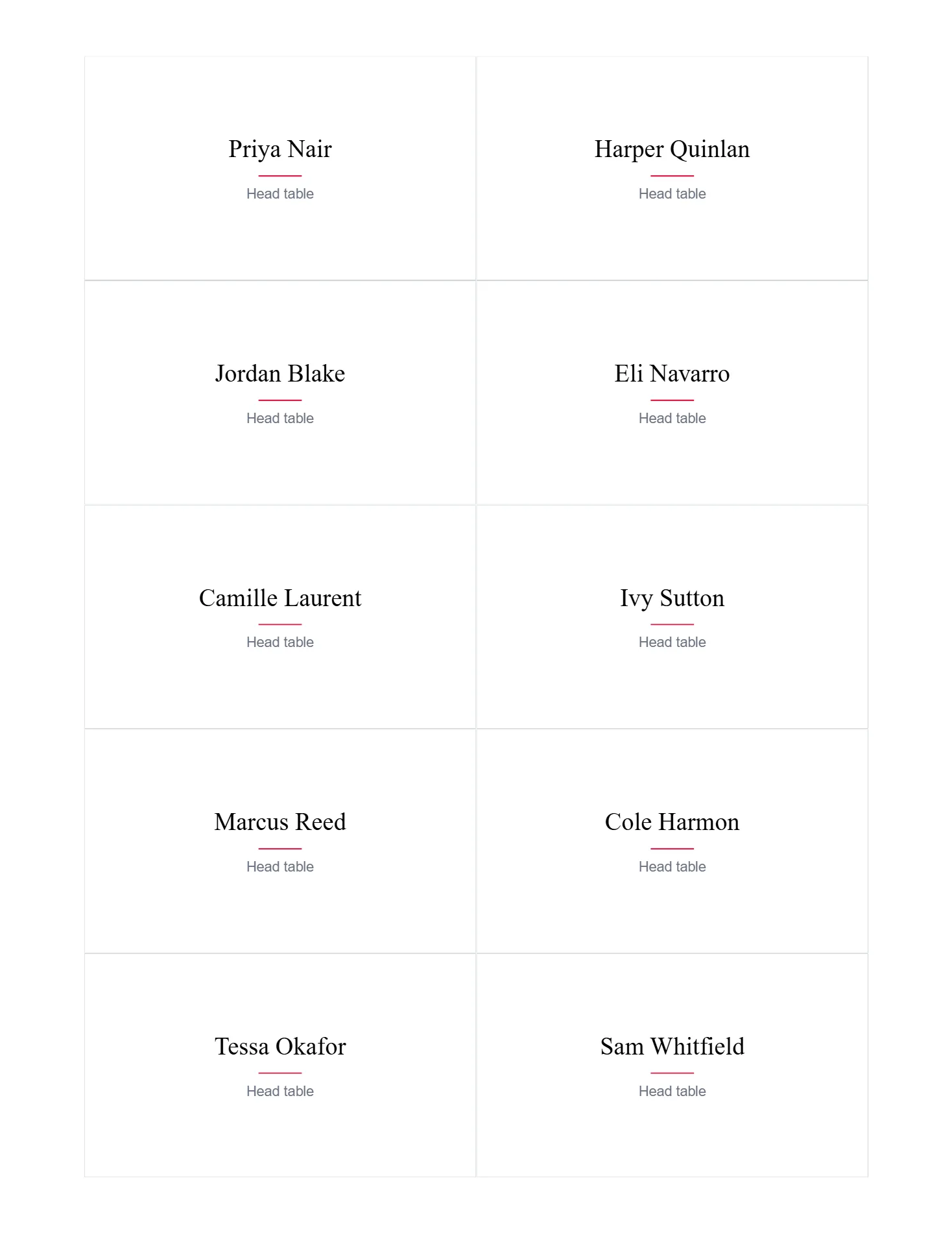 Place cards for the head table, each with a guest's name in serif type.